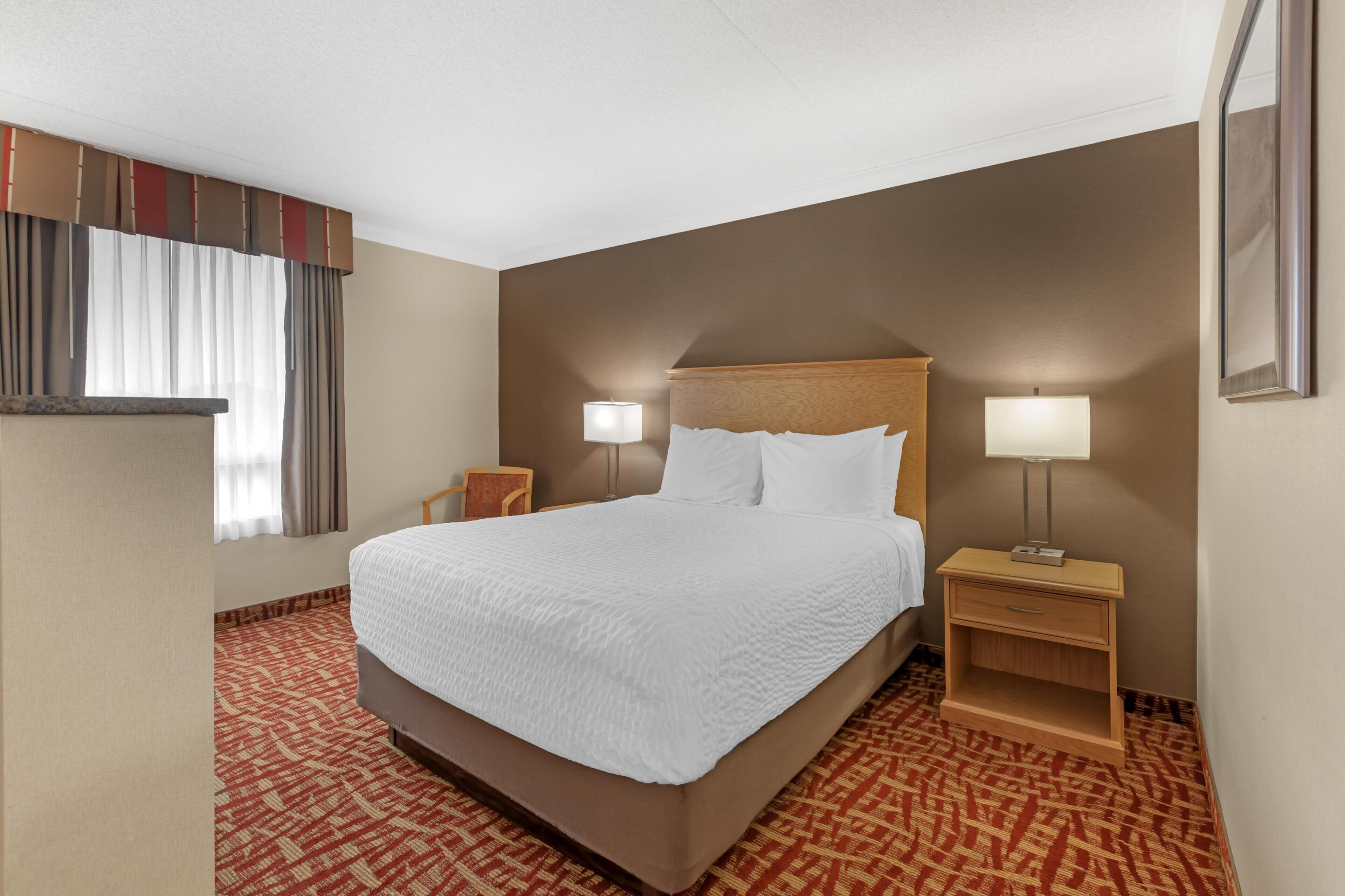 Suite, Multiple Beds, Non Smoking | Premium bedding, in-room safe, desk, laptop workspace