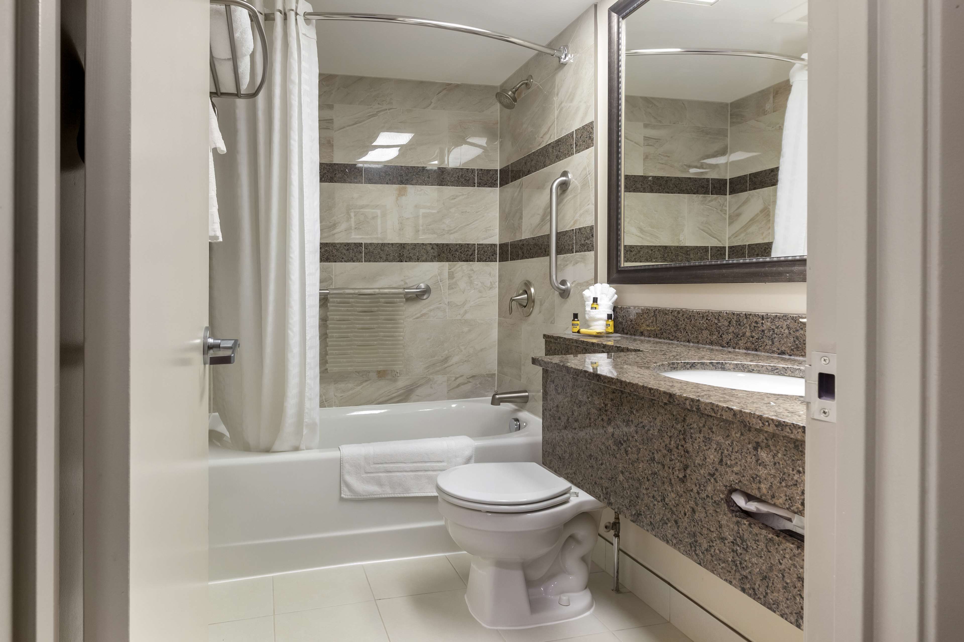 eco-friendly toiletries, hair dryer, towels