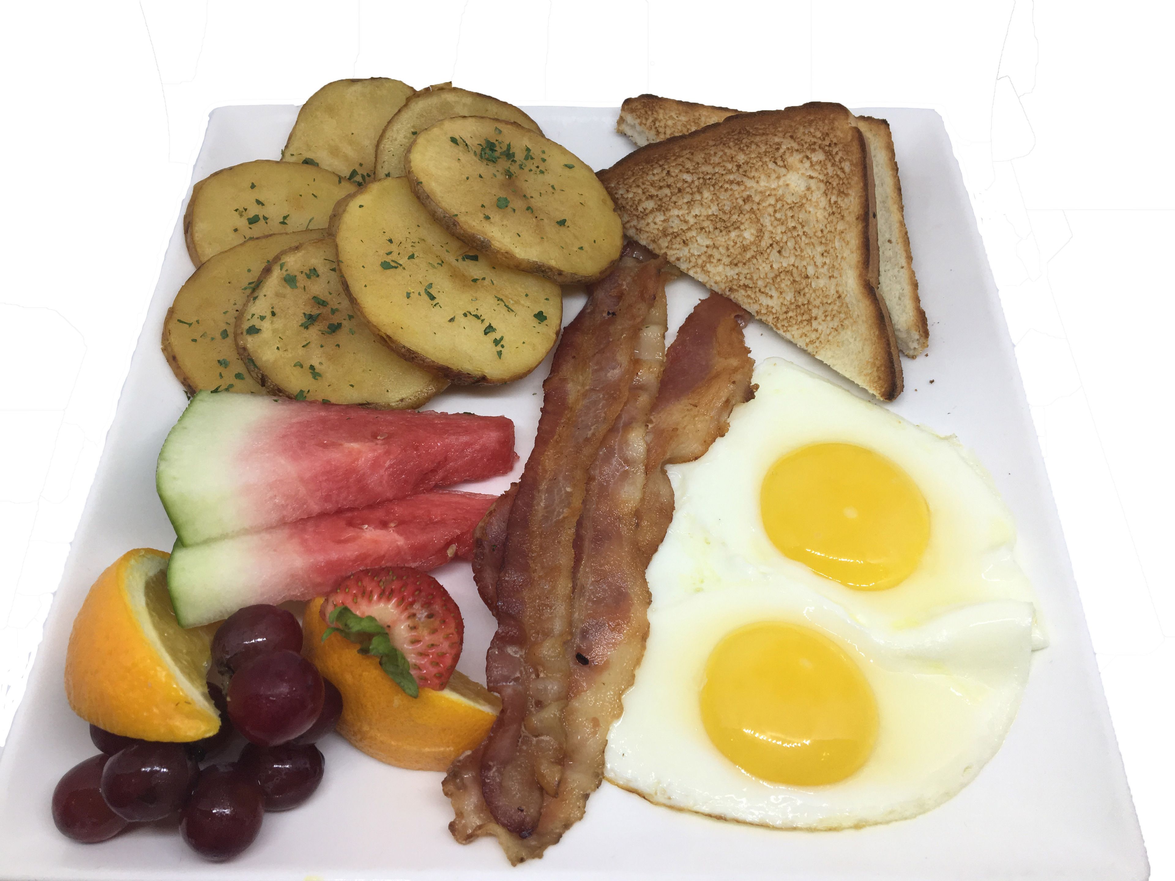 A breakfast plate with toast, eggs, bacon, potatoes, and fruit.