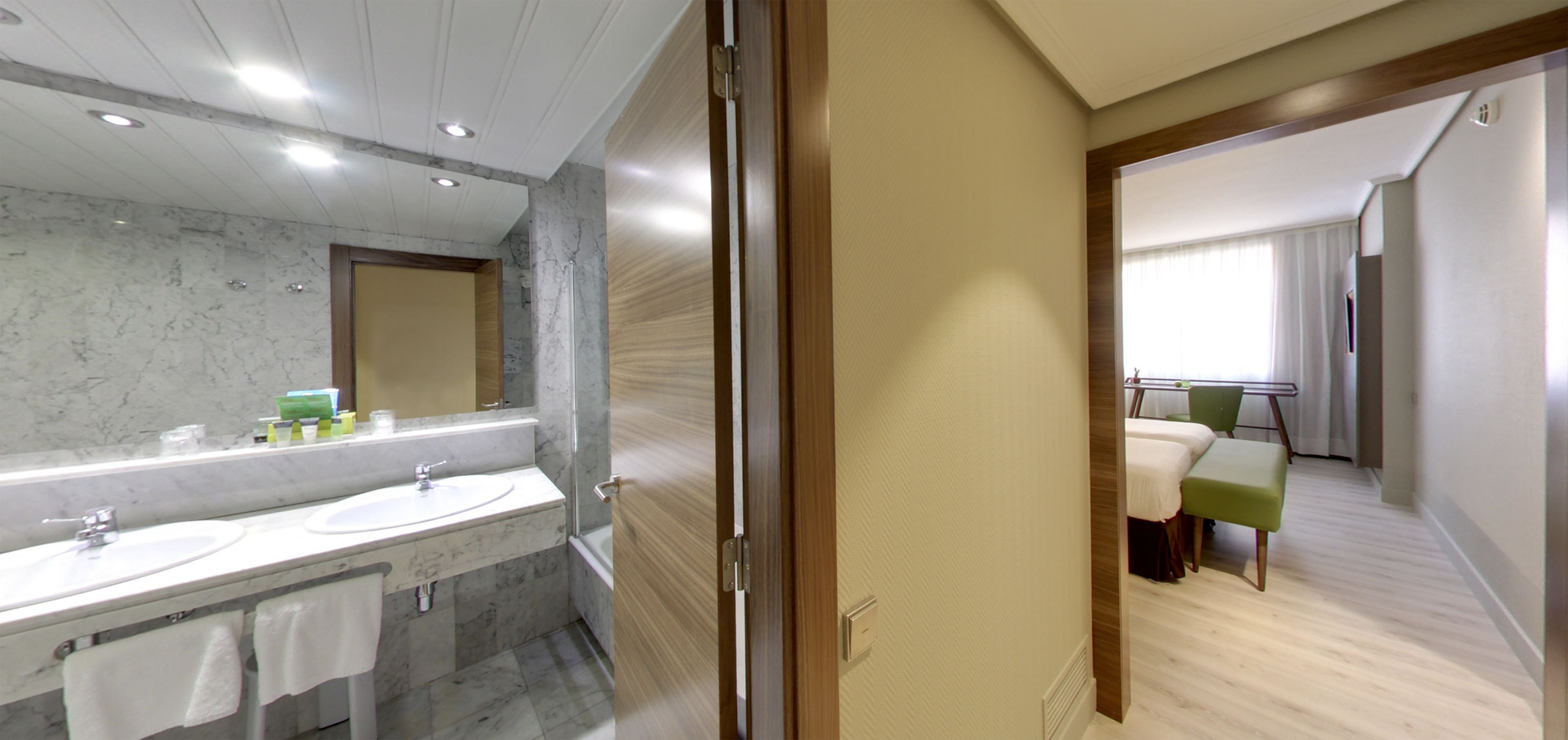 designer toiletries, hair dryer, bidet, towels