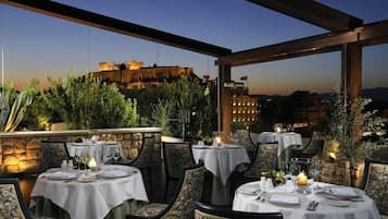 Enjoy a romantic dinner amidst historic charm, with tables set for a serene dining experience.