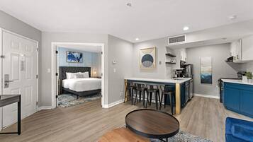 Desk, laptop workspace, iron/ironing board, free cribs/infant beds