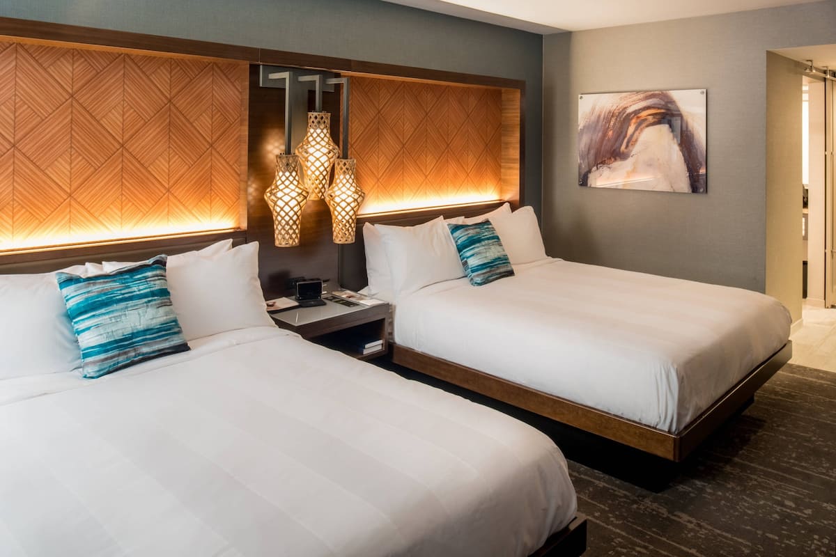 premium bedding, pillow-top beds, desk, laptop workspace