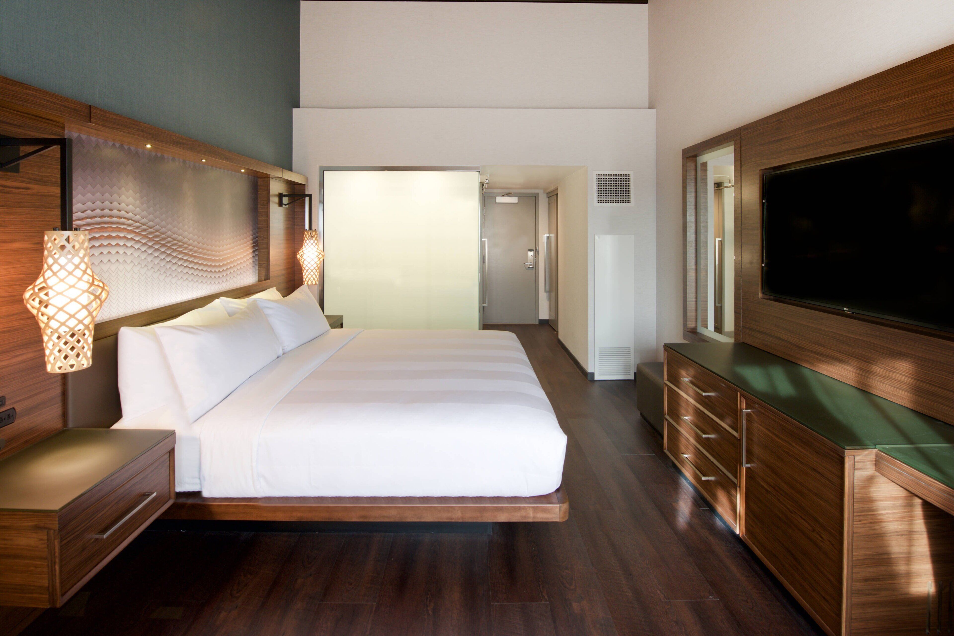 premium bedding, pillow-top beds, desk, laptop workspace