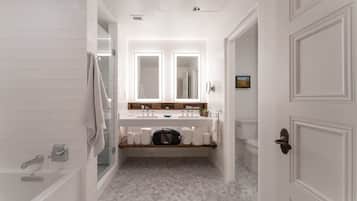 Une salle de bain moderne avec un meuble-lavabo blanc, deux miroirs, une baignoire et une douche.