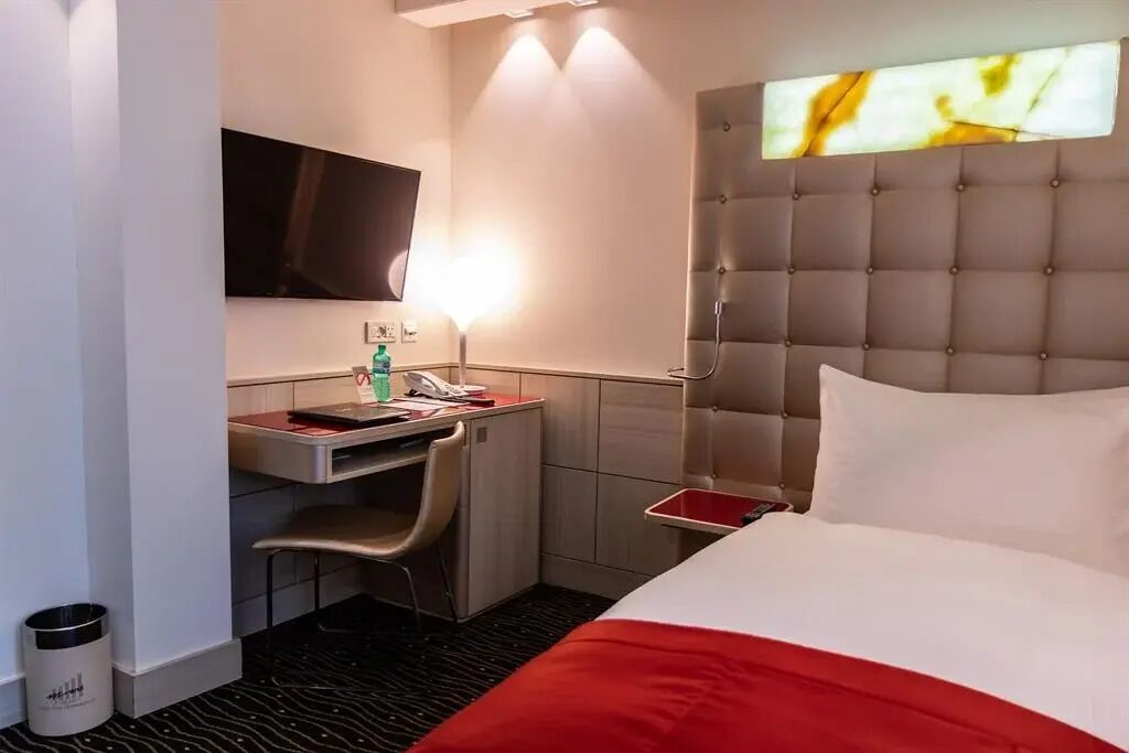 Quarto solteiro empresarial, 1 cama de solteiro, para não fumantes | Frigobar, cofres nos quartos, quartos à prova de som, Wi-Fi de cortesia