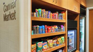 A snack display in a store with various packaged snacks.