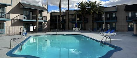 Outdoor pool, open 6:00 AM to 11:00 PM, pool umbrellas, pool loungers