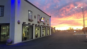 A Days Inn building with a flat facade, multiple windows, and a sign. - Days Inn by Wyndham Santa Fe New Mexico (Santa Fe)