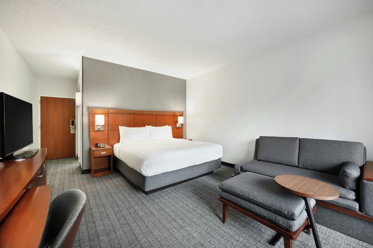 Premium bedding, desk, laptop workspace, iron/ironing board