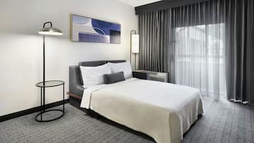 Premium bedding, desk, laptop workspace, iron/ironing board