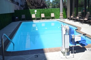 Seasonal outdoor pool, open 10 AM to 10 PM, pool loungers