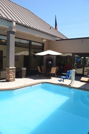 Seasonal outdoor pool, open 10 AM to 10 PM, pool loungers