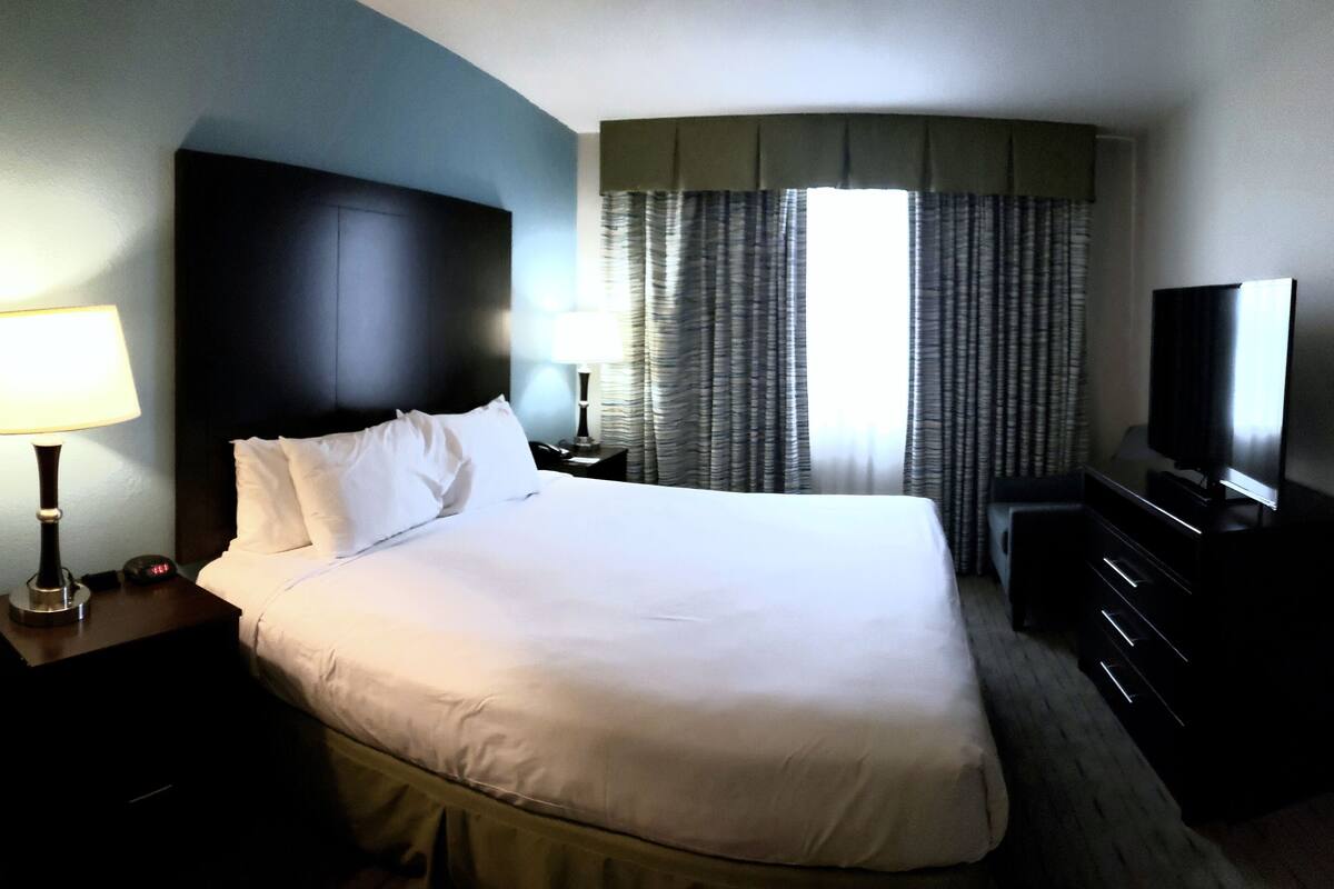 Accessible King Bath | 1 bedroom, desk, blackout curtains, iron/ironing board