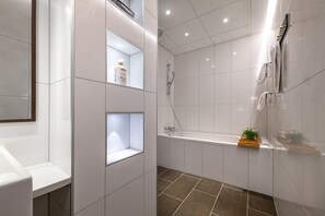Junior Suite | Bathroom | Rainfall showerhead, hair dryer, towels