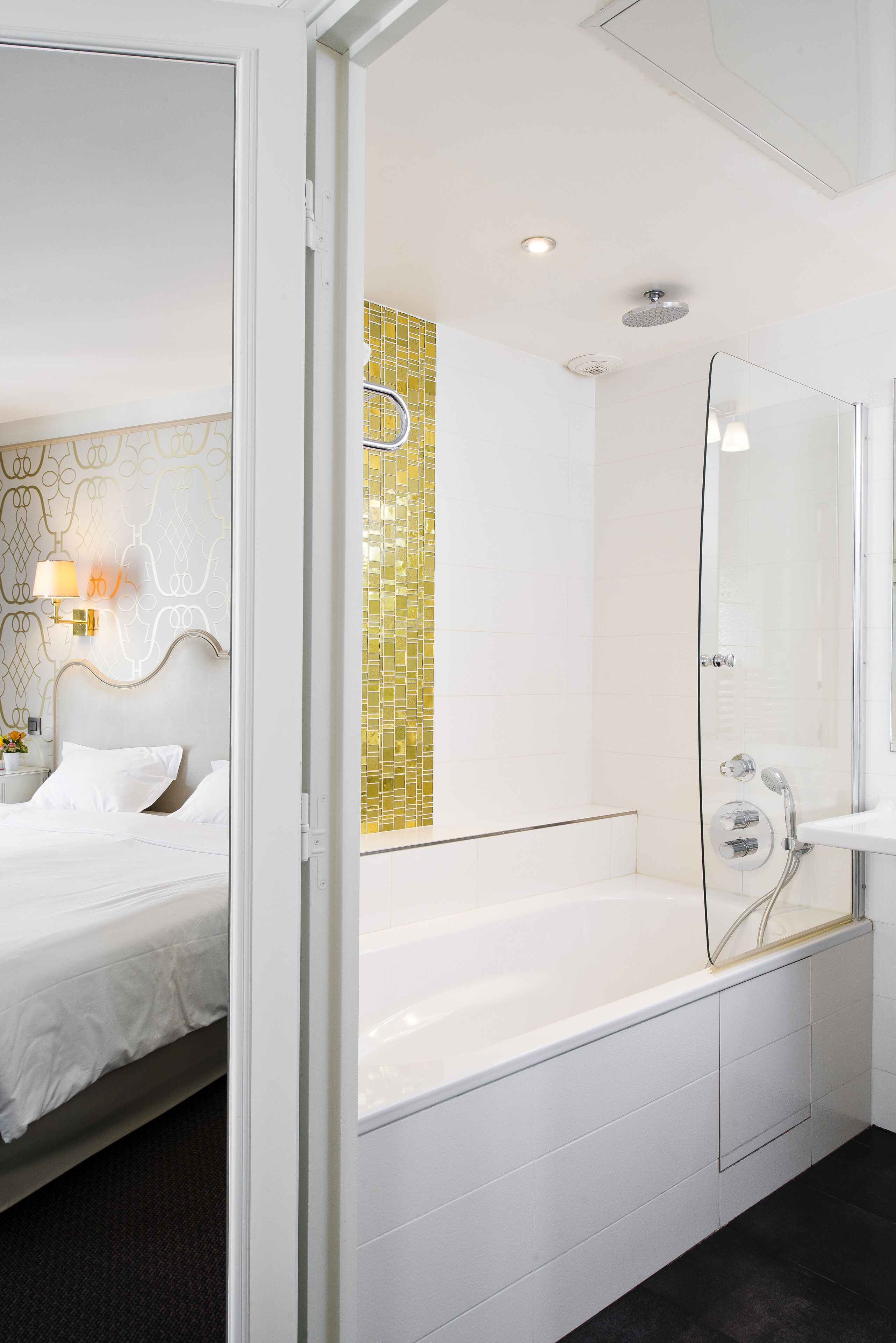 deluxe room | bathroom | rainfall showerhead, free toiletries, hair dryer, slippers