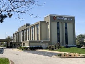Comfort Inn features a modern architectural design with a prominent sign and multiple windows.