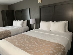 Premium bedding, pillow-top beds, desk, laptop workspace