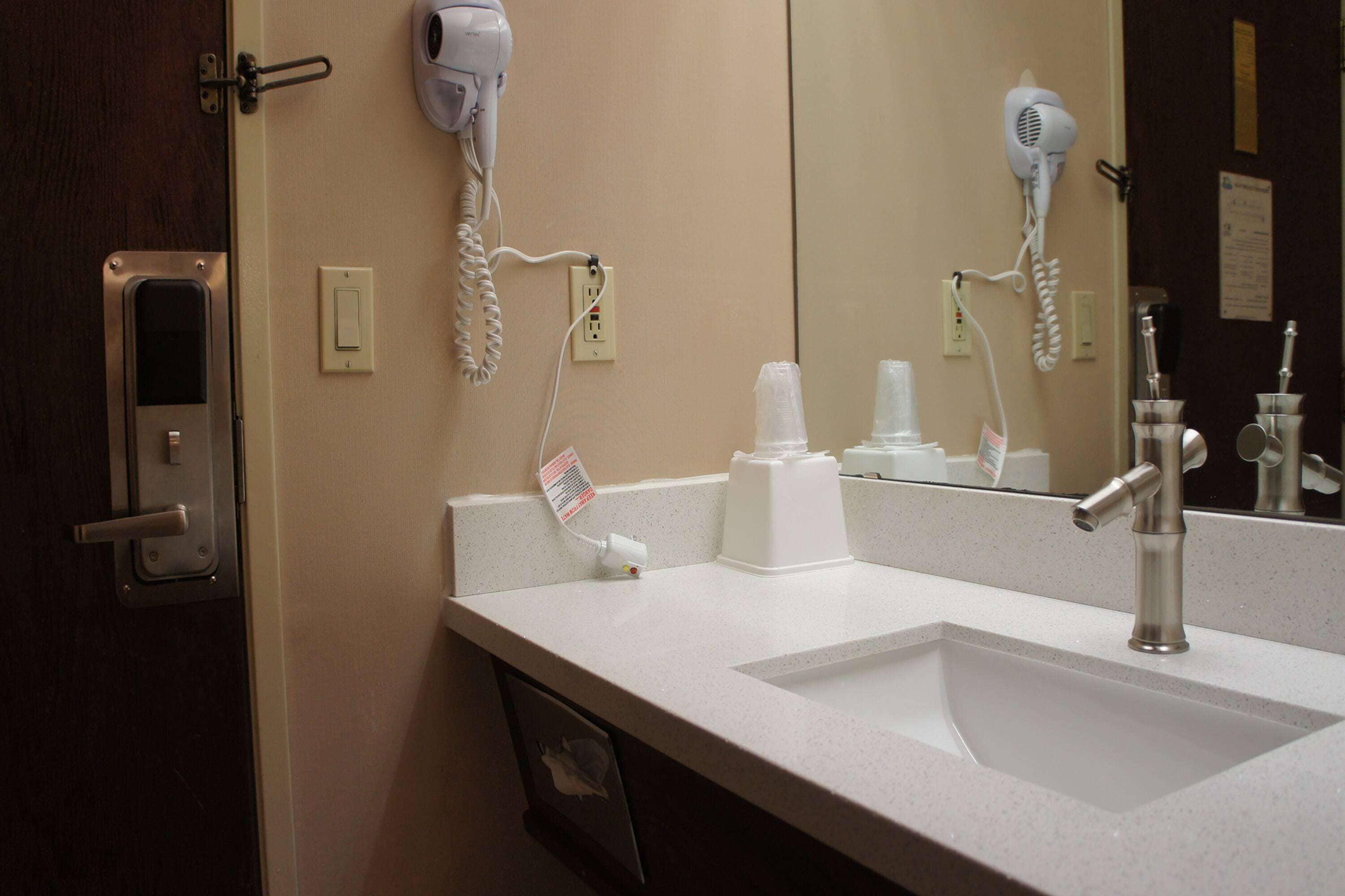 designer toiletries, hair dryer, towels