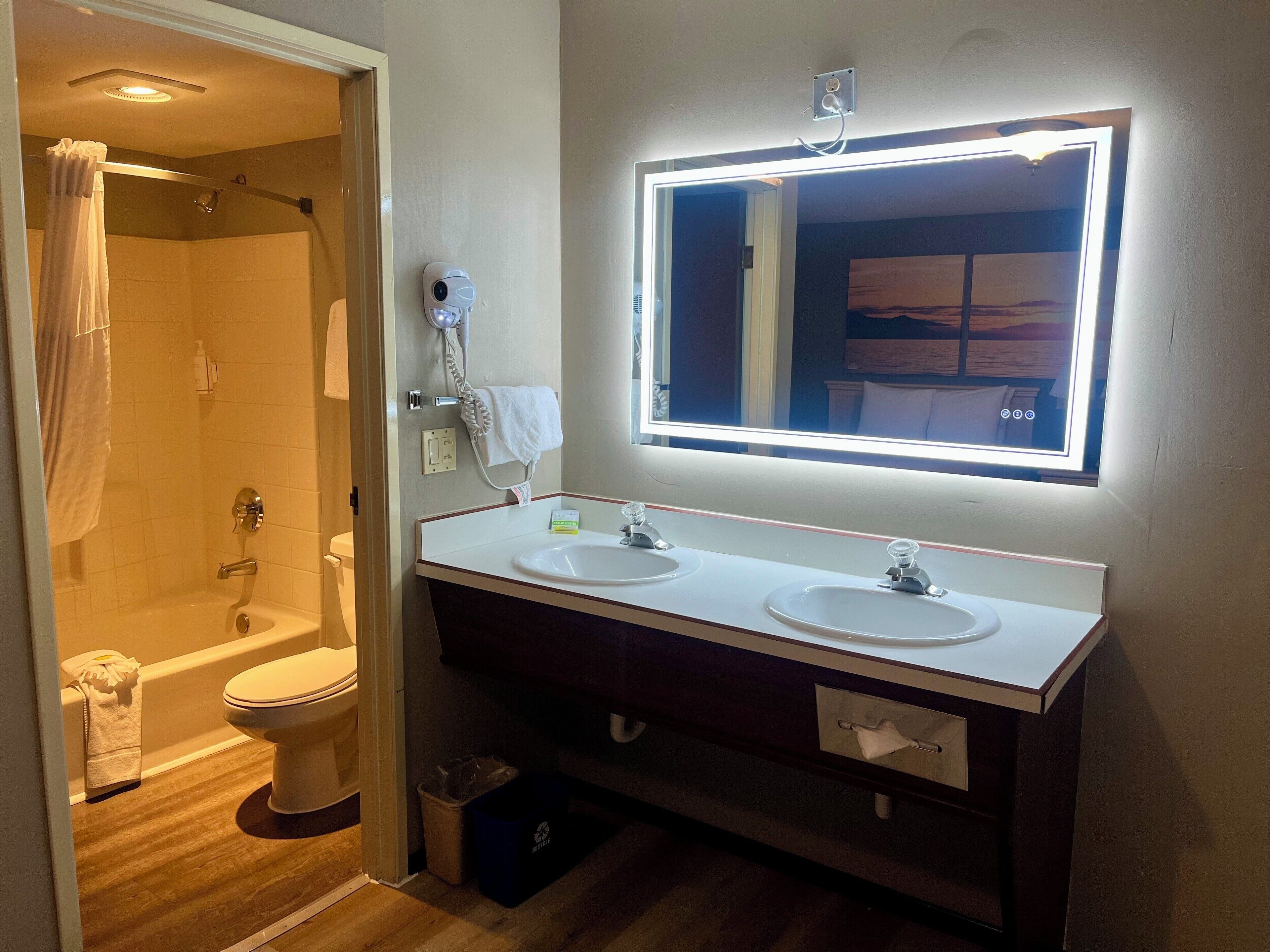 designer toiletries, hair dryer, towels