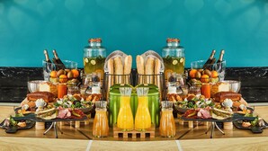 A breakfast buffet with a variety of foods and drinks, including pastries, sandwiches, and juice. - Mercure Beaune Centre (Beaune)