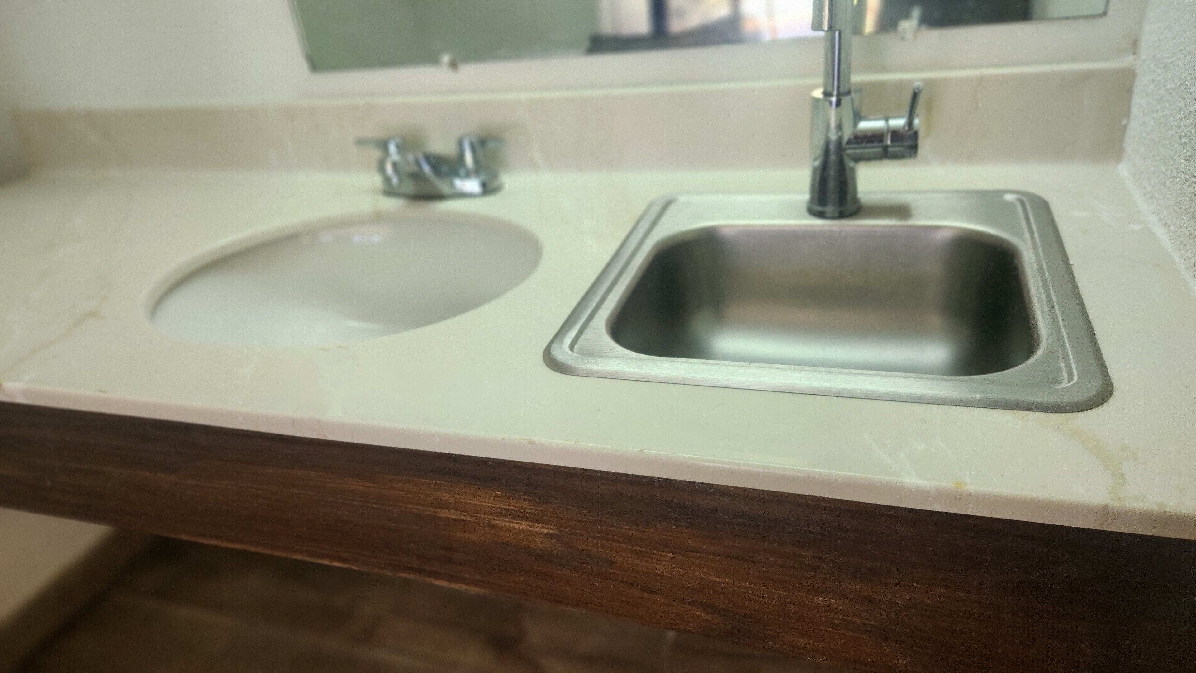 A bathroom sink with a mirror above it.