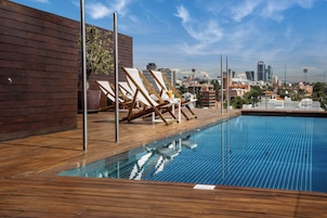 Seasonal outdoor pool, open noon to 7:00 PM, pool umbrellas