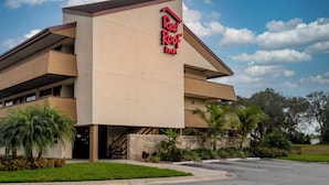 A building with a flat roof and a sign that reads 'Red Roof Inn.' - Red Roof Inn Tampa - Brandon (Tampa)