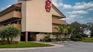A building with a flat roof and a sign that reads 'Red Roof Inn.' - Red Roof Inn Tampa - Brandon (Tampa)