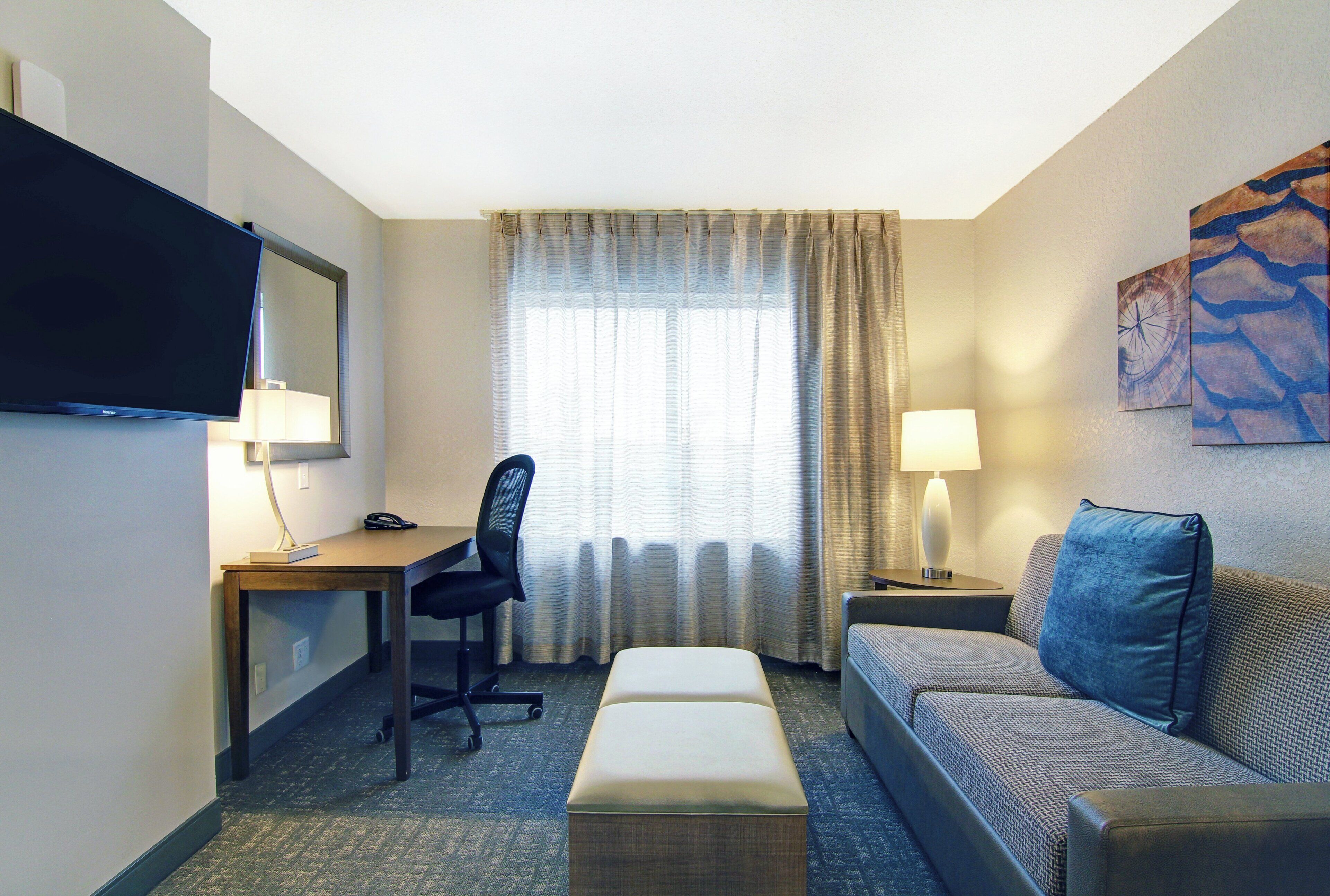 Down comforters, desk, blackout drapes, iron/ironing board