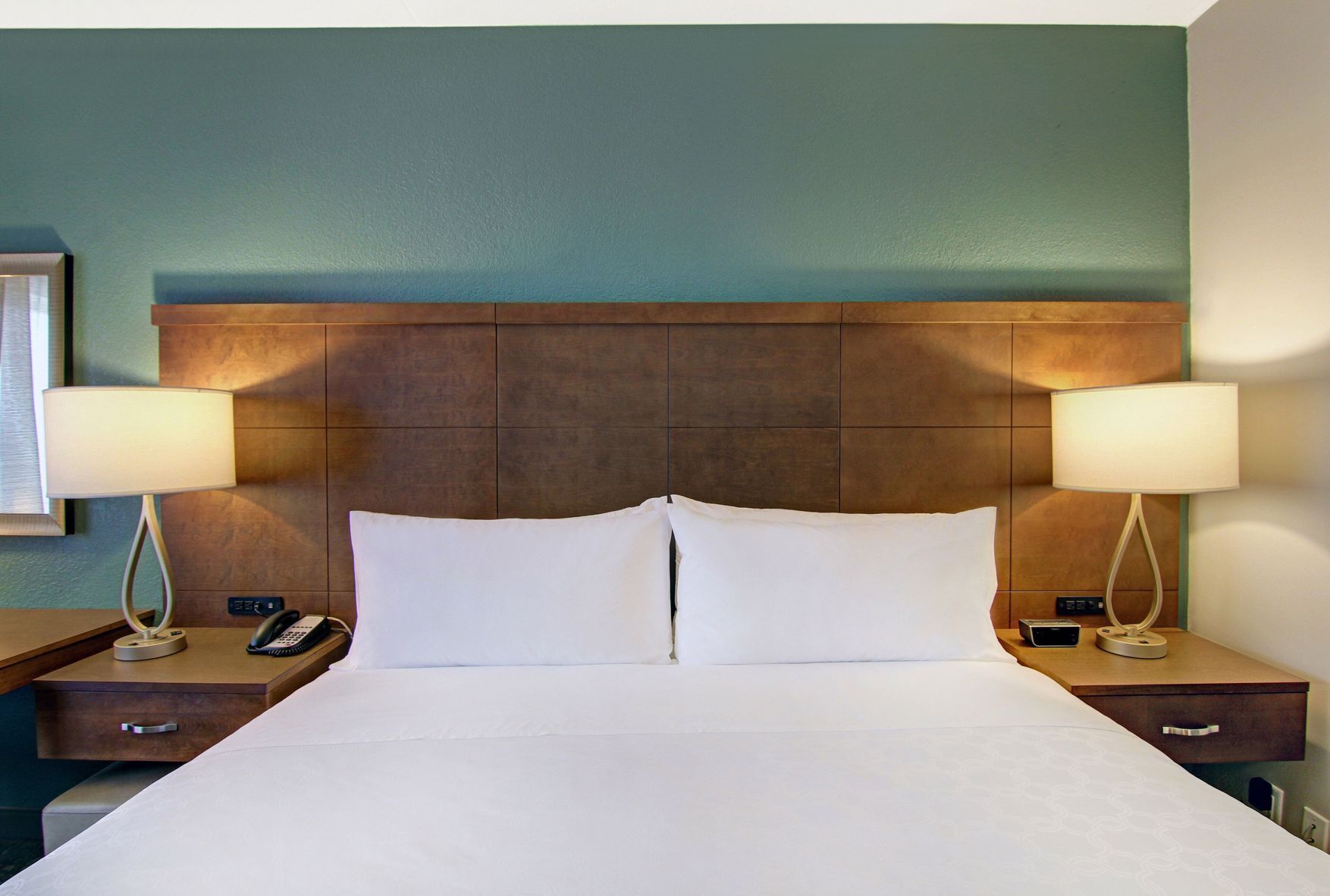 Down comforters, desk, blackout drapes, iron/ironing board