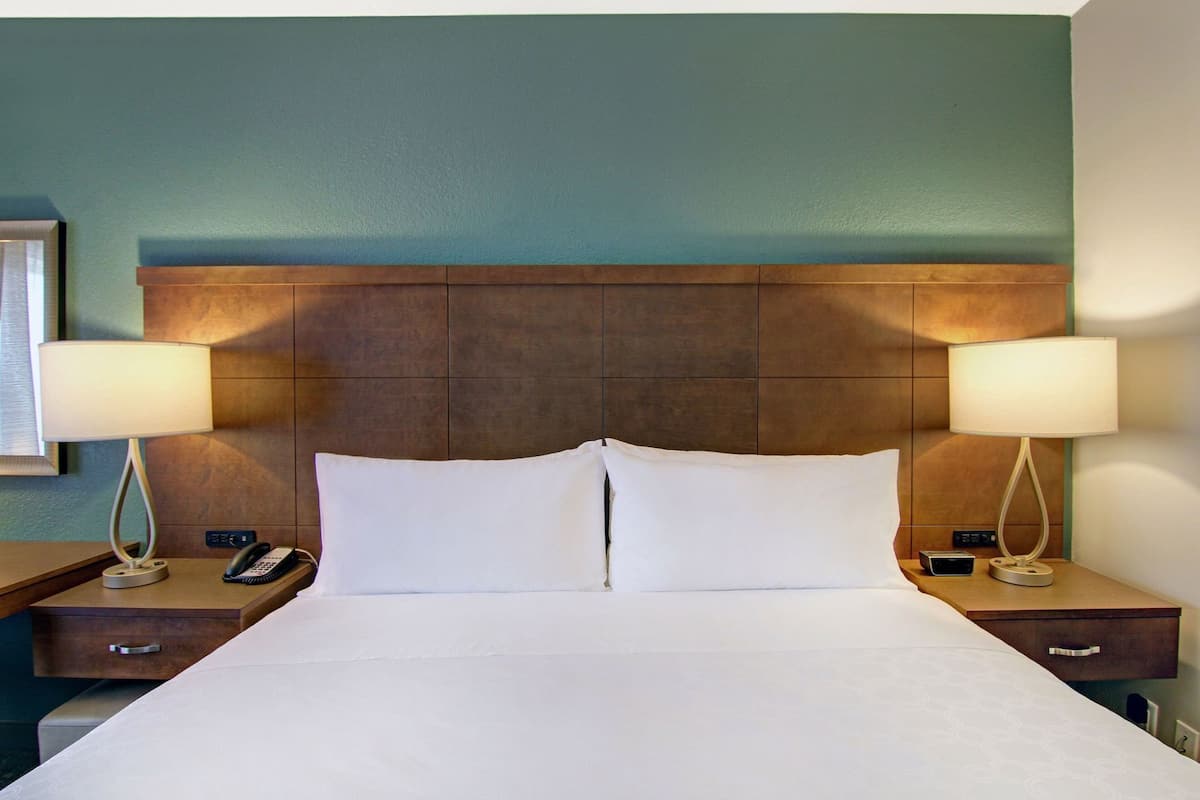 Down comforters, desk, blackout drapes, iron/ironing board