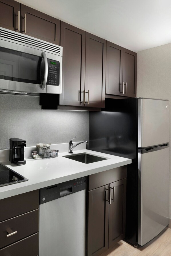 Full-sized fridge, microwave, stovetop, dishwasher