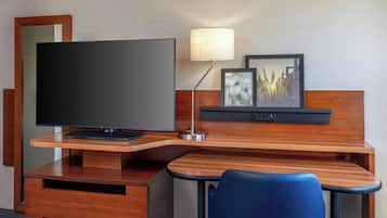 Desk, laptop workspace, iron/ironing board, travel crib