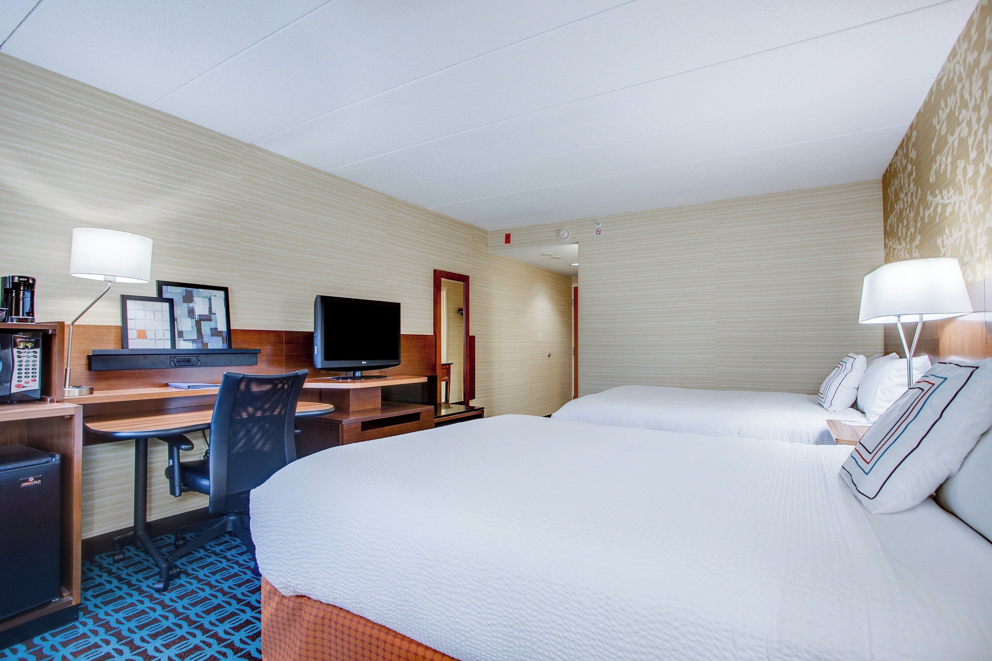 room, 2 queen beds | desk, laptop workspace, iron/ironing board, travel cot