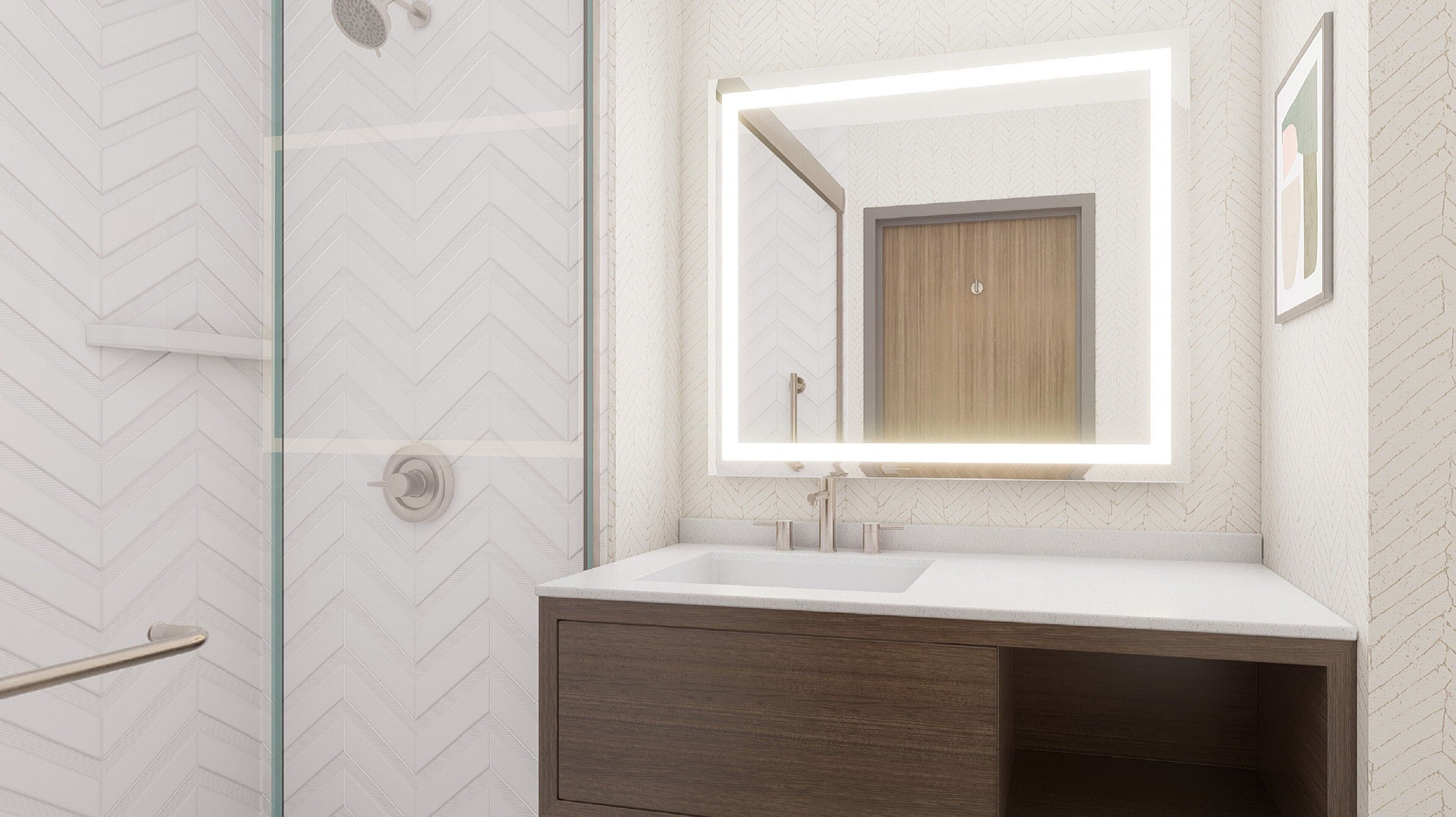 A modern bathroom with a herringbone-patterned wall, a glass shower enclosure, a white sink, and a wooden vanity.