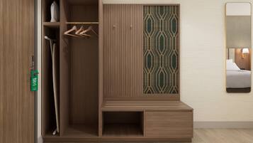 A walk-in closet with wooden paneling, a hanging rod, and a patterned divider.