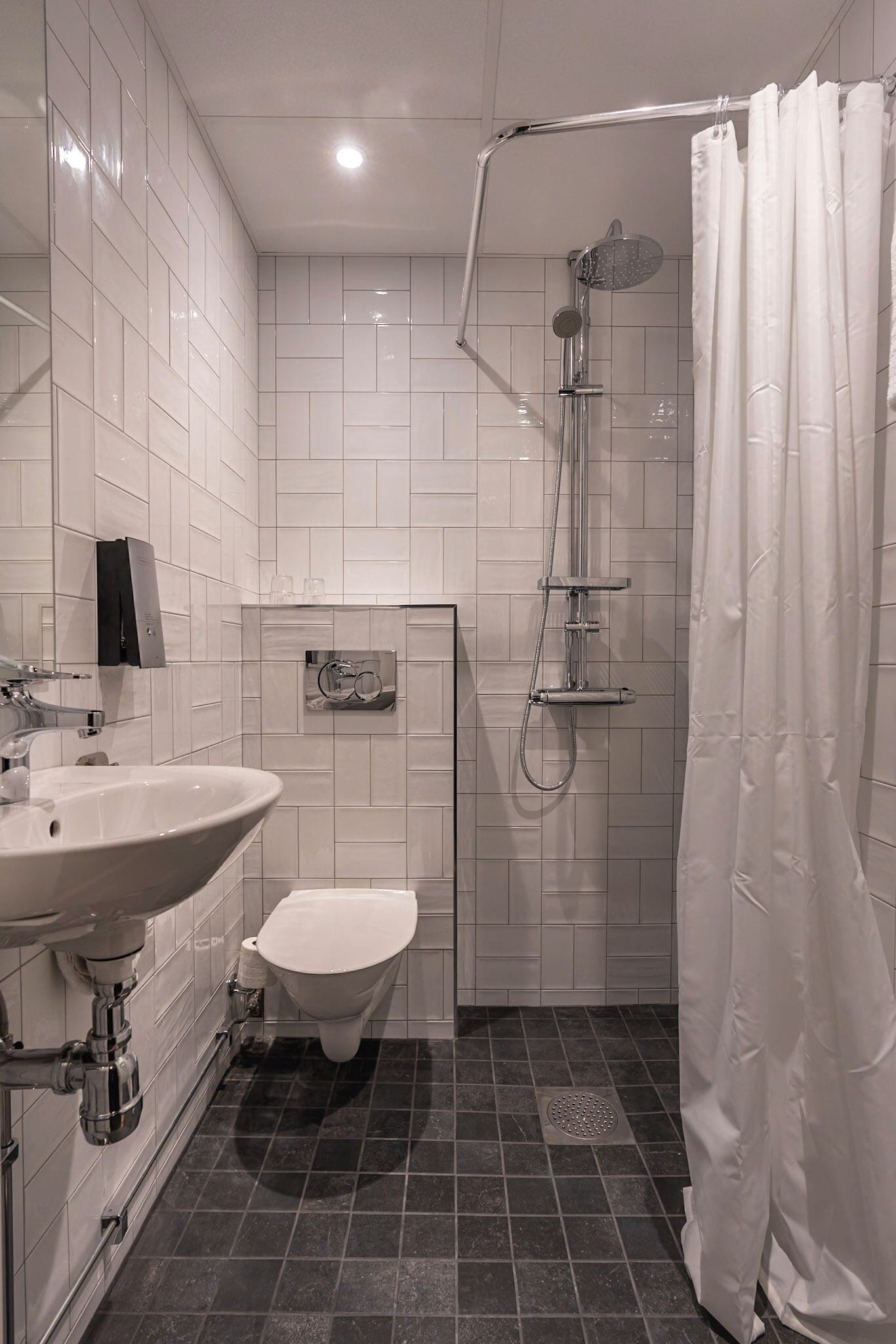 small double room (no window) | bathroom | shower, eco-friendly toiletries, hair dryer, towels