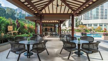 Outdoor pool, open 6:00 AM to 10:00 PM, pool umbrellas