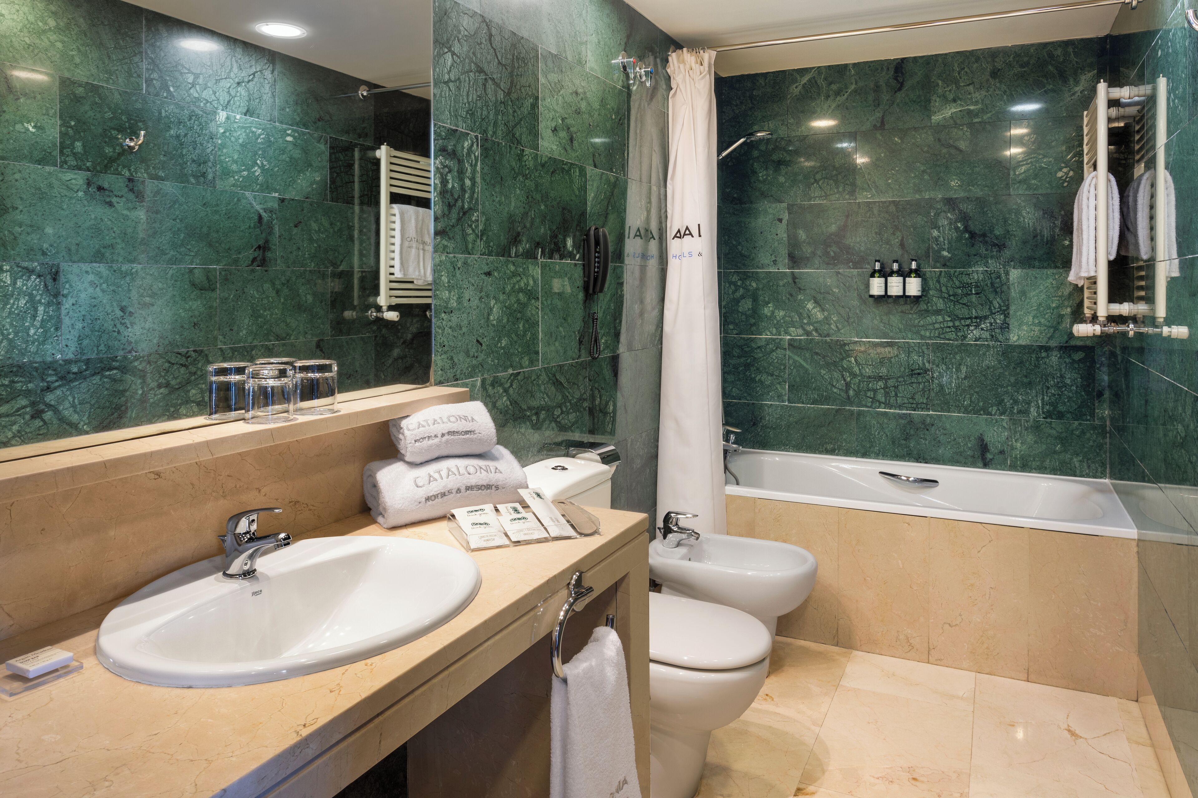 eco-friendly toiletries, hair dryer, bidet, towels