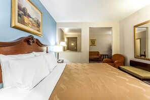 Premium bedding, desk, laptop workspace, blackout drapes