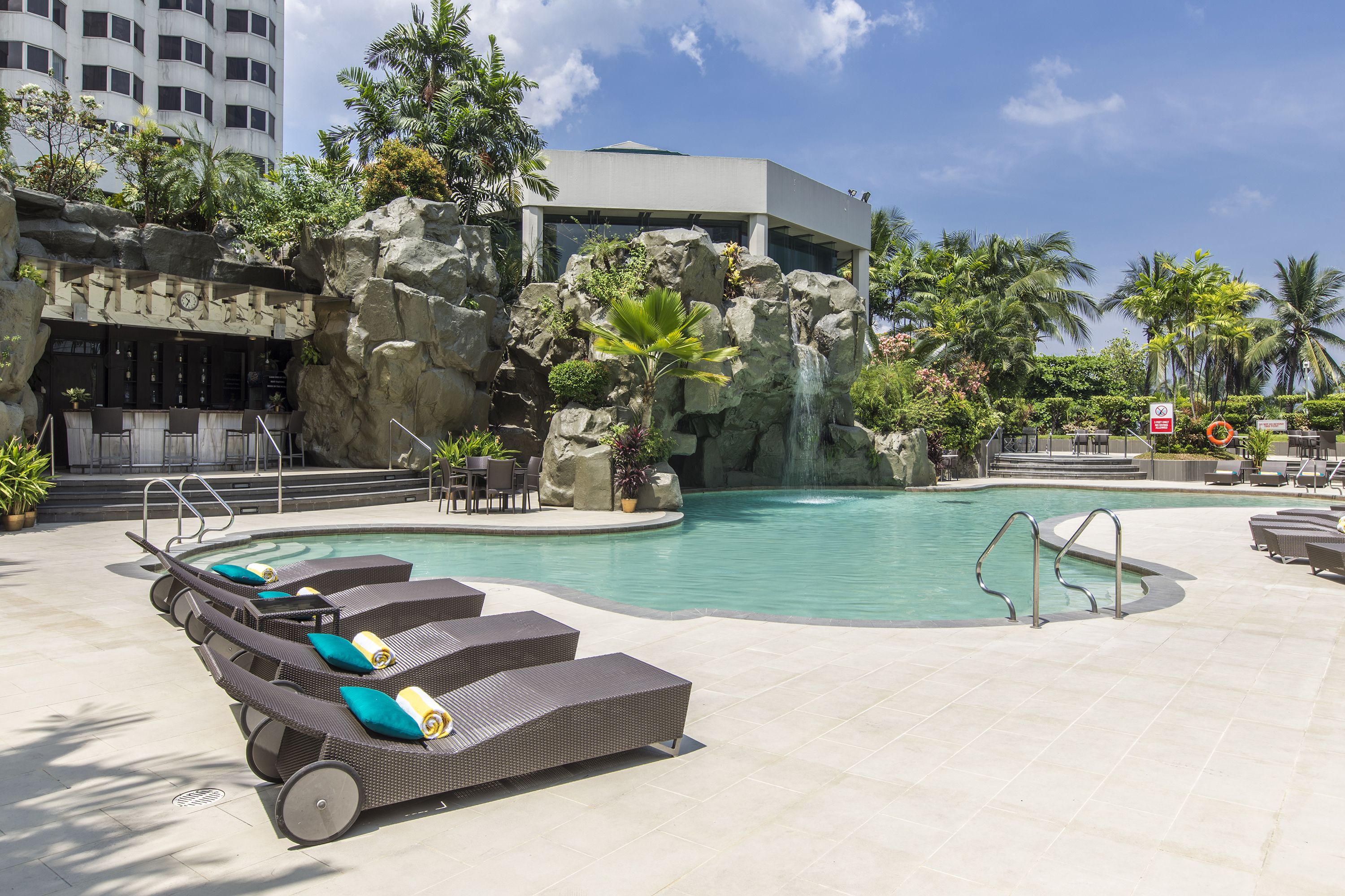 outdoor pool, pool umbrellas, pool loungers