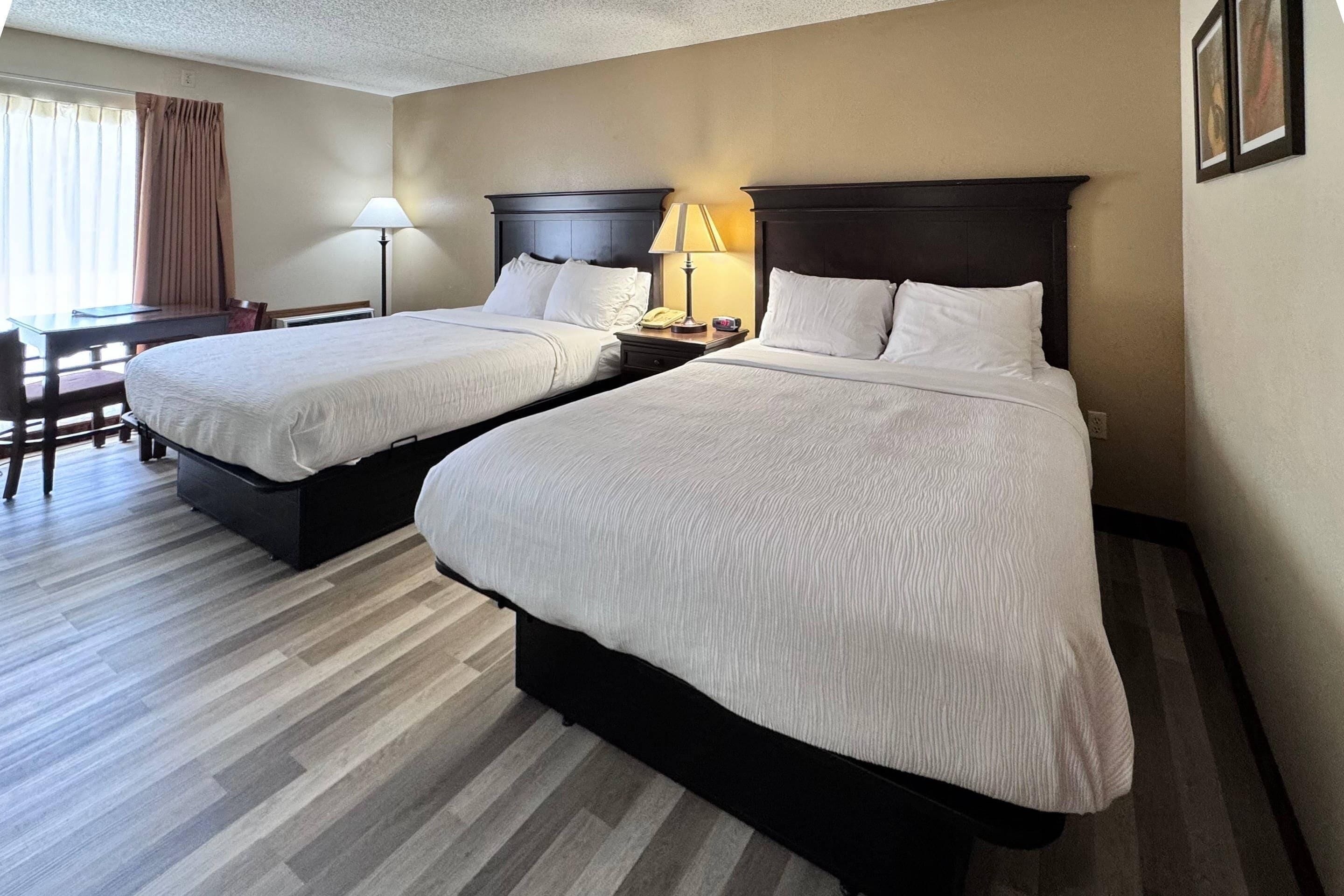 room, 2 queen beds, non smoking | desk, iron/ironing board, free cots/infant beds, rollaway beds