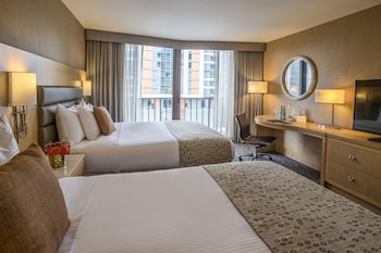In-room safe, desk, blackout drapes, iron/ironing board at Warwick Seattle