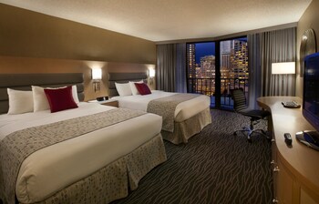 In-room safe, desk, blackout drapes, iron/ironing board at Warwick Seattle