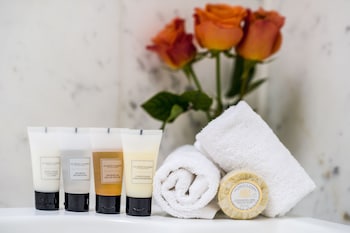 In-room safe, desk, blackout drapes, iron/ironing board at Warwick Seattle