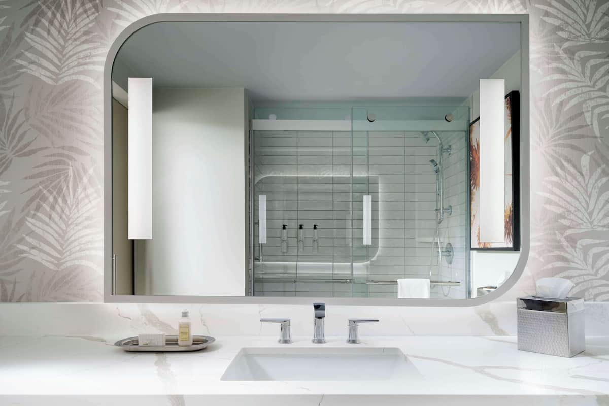 designer toiletries, hair dryer, towels, soap