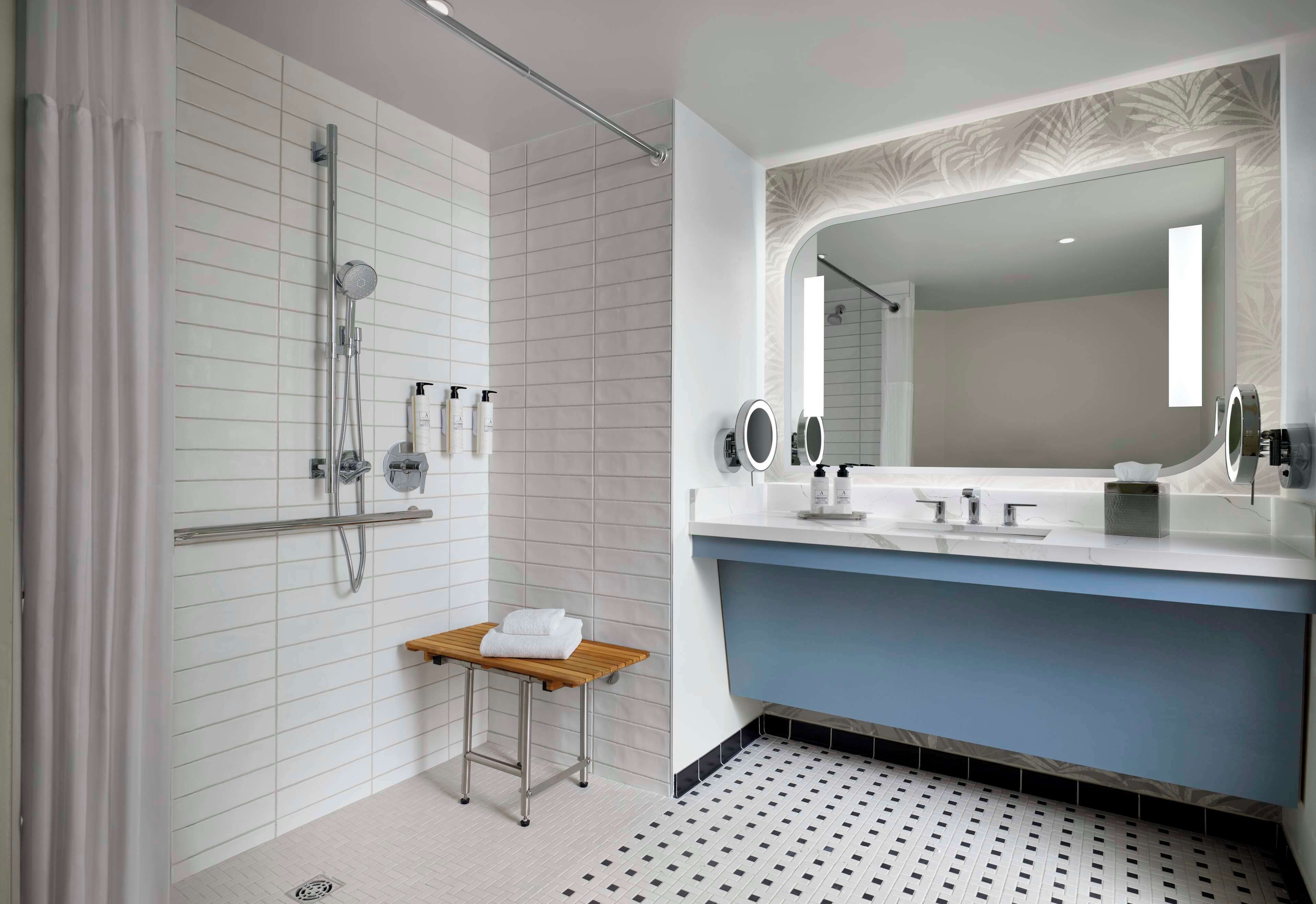 designer toiletries, hair dryer, towels, soap