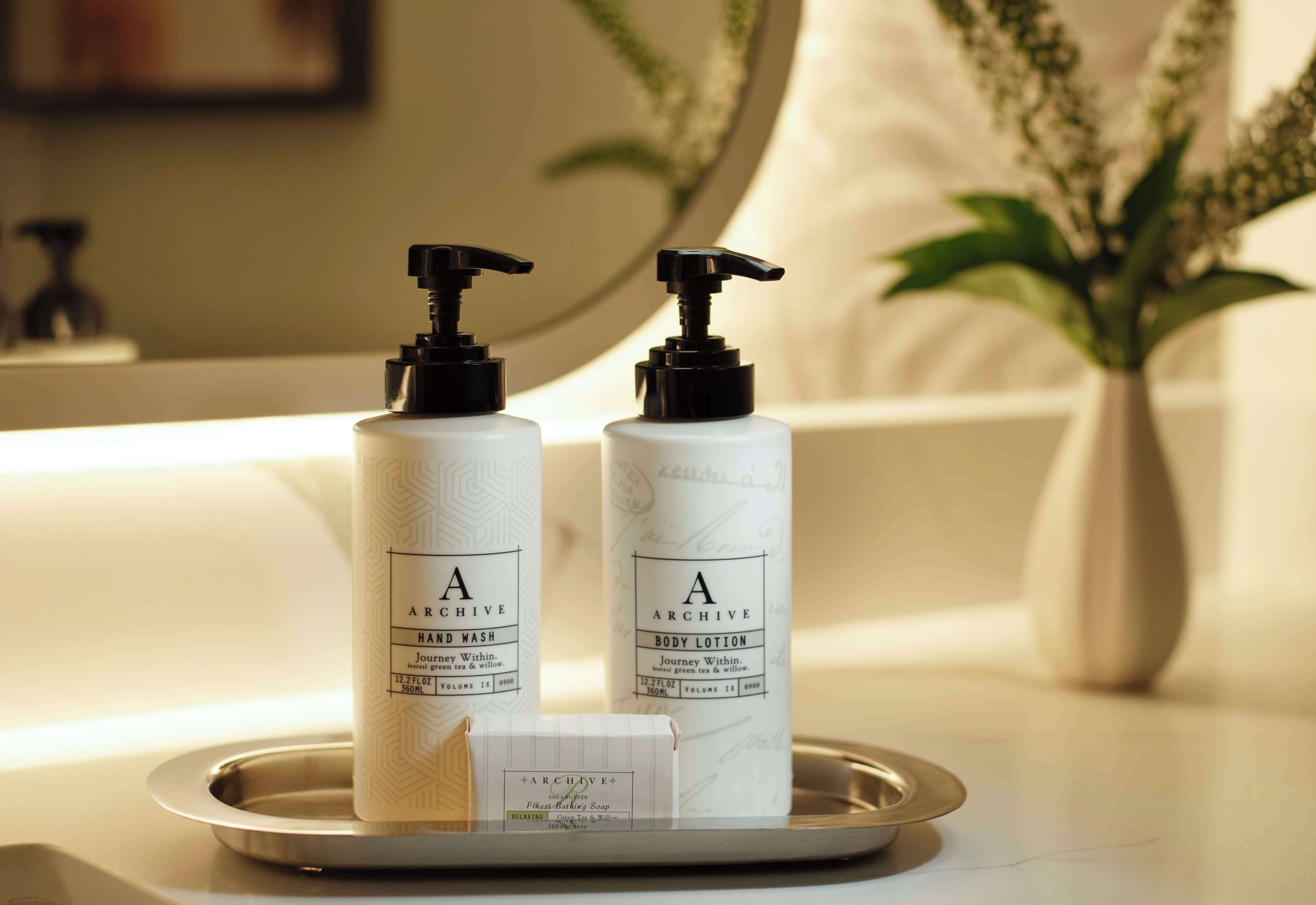 designer toiletries, hair dryer, towels, soap