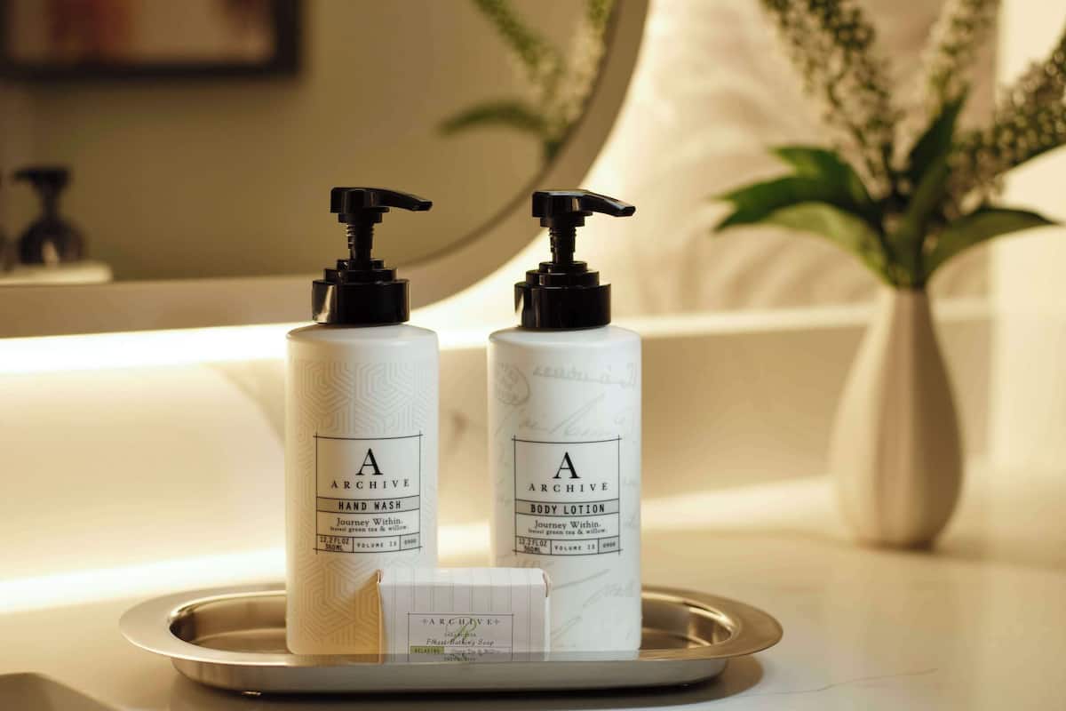 designer toiletries, hair dryer, towels, soap